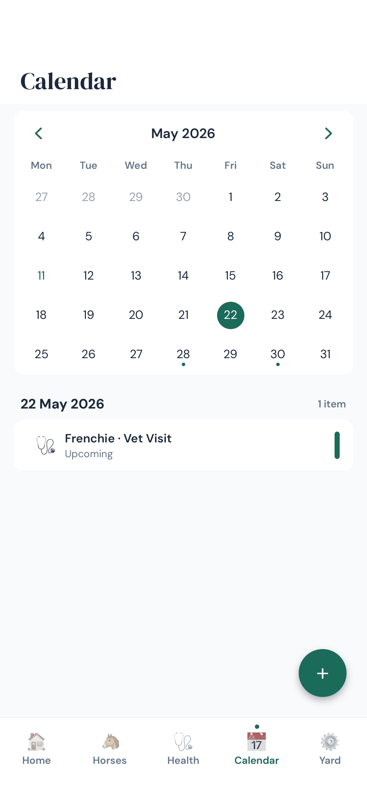 Calendar tab showing the month with a vet visit scheduled